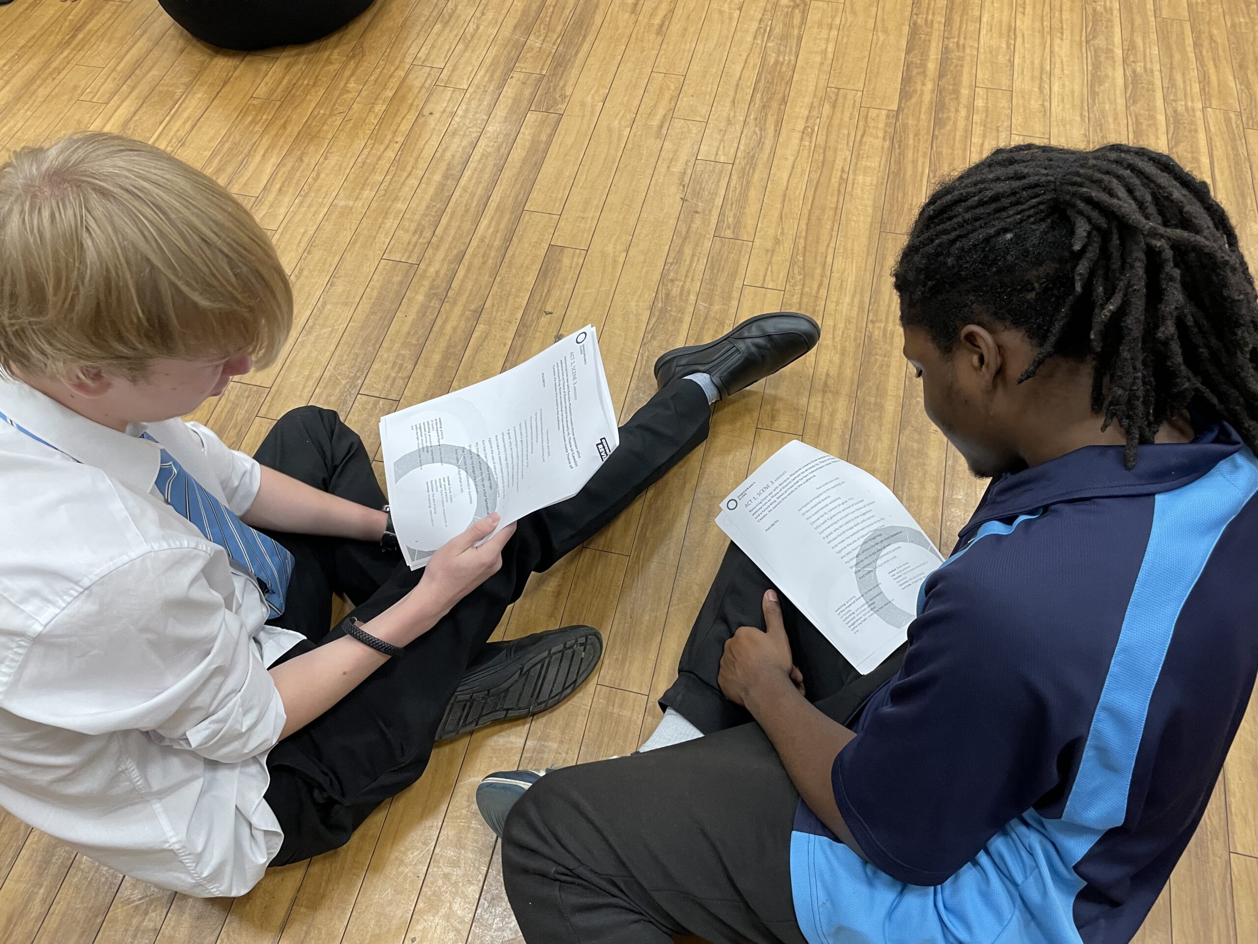 Two students reading their Study Boost session booklets